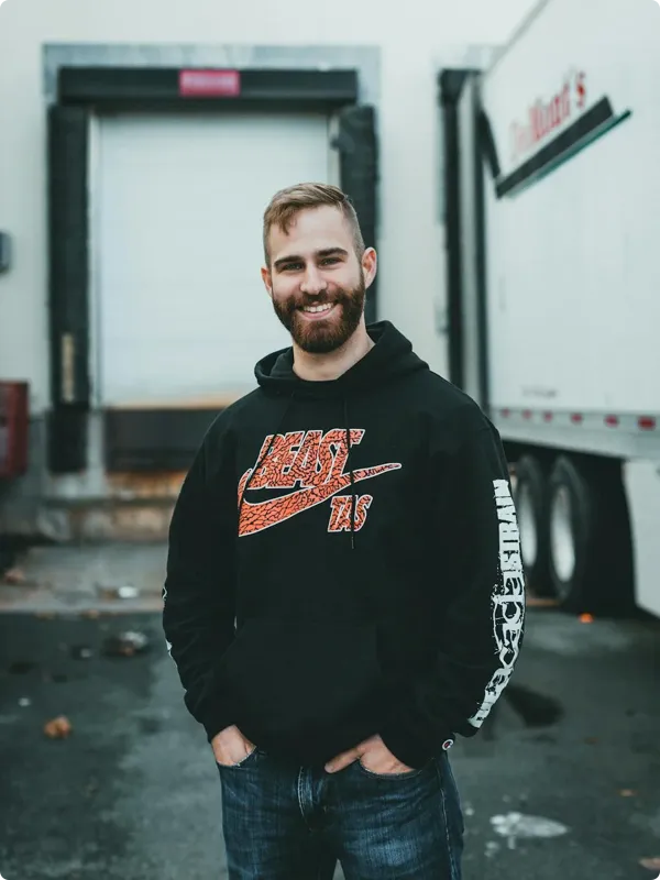 guy standing in front of a truck